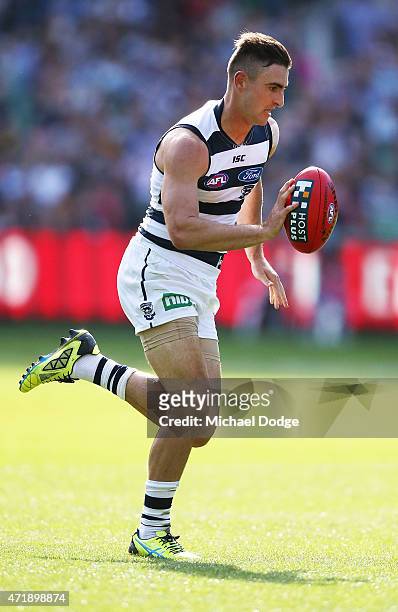 Shane Kersten of the Cats runs with the ball during the round five AFL match between the Richmond Tigers and the Geelong Cats at Melbourne Cricket...