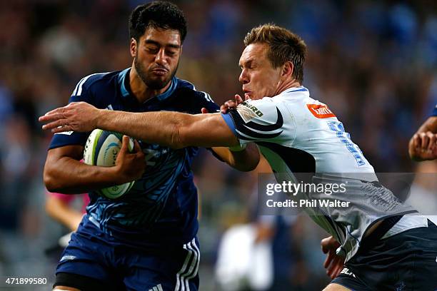 Ikira Ioane of the Blues is tackled by Dane Haylett Petty of the Western Force during the round 12 Super Rugby match between the Blues and the Force...