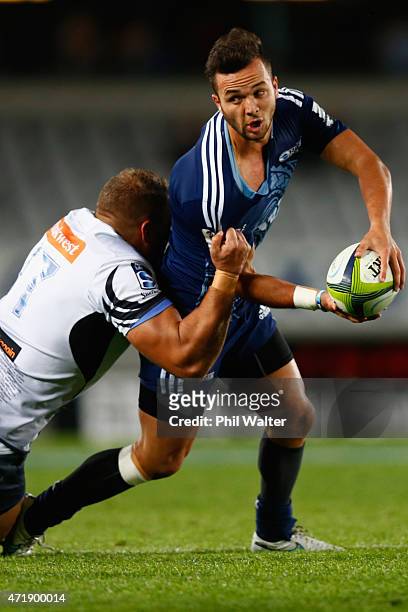 Jamison Gibson-Park of the Blues is tackled during the round 12 Super Rugby match between the Blues and the Force at Eden Park on May 2, 2015 in...