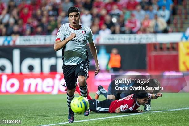 Enrique Perez of Atlas drives the ball during a match between Tijuana and Atlas as part of 16th round of Clausura 2015 Liga MX at Caliente Stadium on...