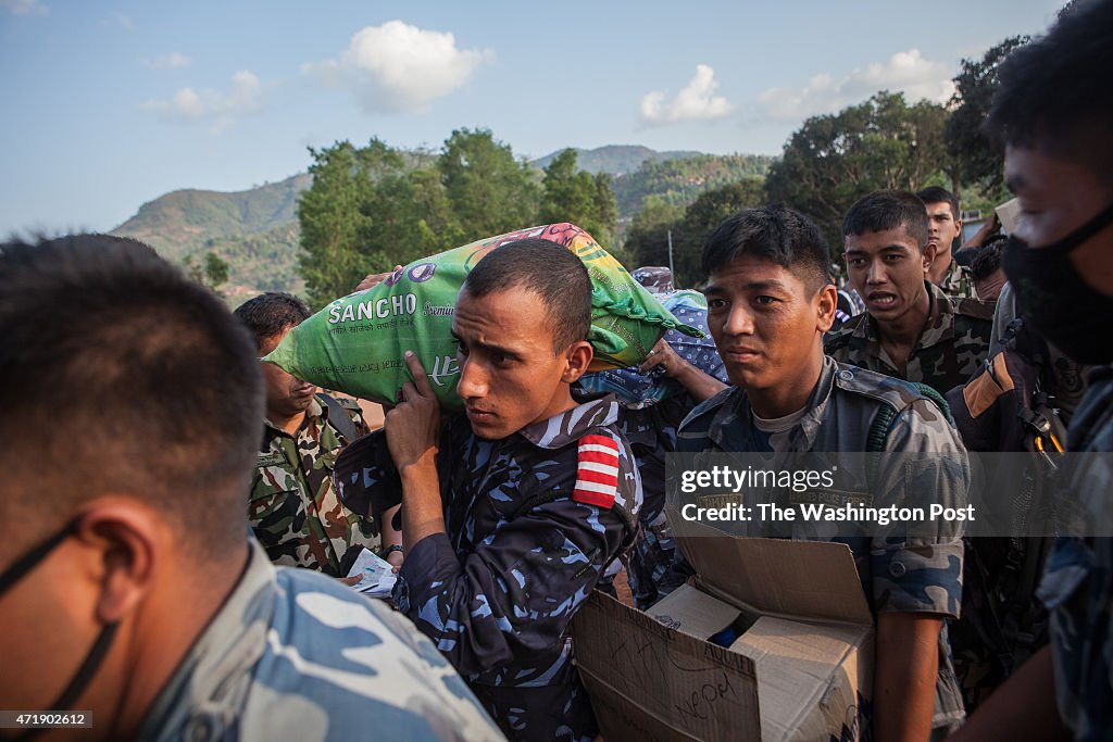 NEPAL, APRIL 30:  Nepal military unload supplies in a village i