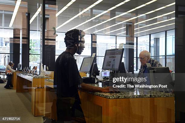 Norman James of DC uses a computer in the new Digital Commons space At Martin Luther King, Jr Memorial Library on Thursday, August 8 in Washington,...