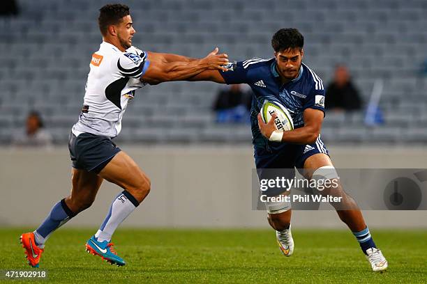 Ikira Ioane of the Blues is tackled during the round 12 Super Rugby match between the Blues and the Force at Eden Park on May 2, 2015 in Auckland,...