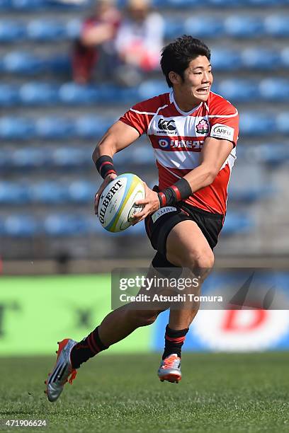 Yoshikazu Fujita of Japan runs with the ball during the Asian Rugby Championship game between Japan and Hong Kong at Prince Chichibu Stadium on May...