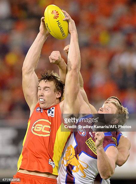 Tom Lynch of the Suns competes for the ball during the round five AFL match between the Gold Coast Suns and the Brisbane Lions at Metricon Stadium on...