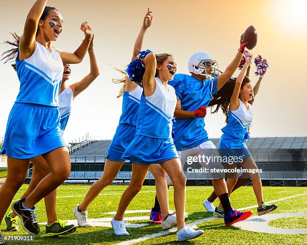 cheerleader & football player - asian cheerleaders stock-fotos und bilder