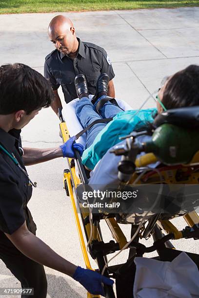Loading Ambulance 164 Paramedics Loading Patient Into Ambulance Stock Photos, High-Res ...