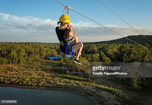 zipping fun girl - zipline stock pictures, royalty-free photos & images