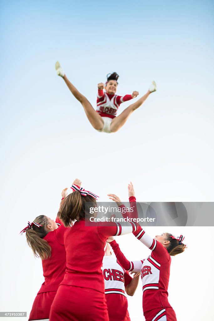 Cheerleaders Throw Up A Girl In The Air High Res Stock Photo Getty Images cheerleaders-throw-up-a-girl-in-the-air-high-res-stock-photo-getty-images
