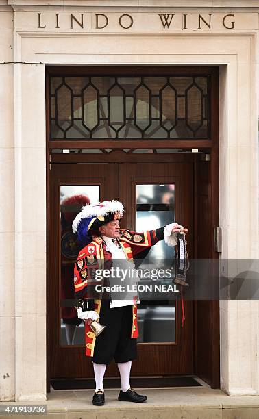 Town crier Tony Appleton makes an announment of the birth of Catherine, Duchess of Cambridge and Prince William's second child, a daughter, outside...