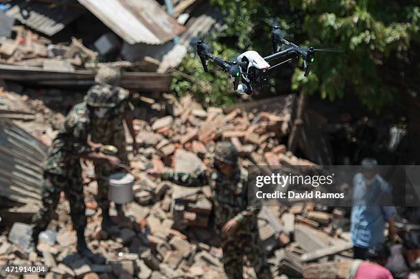 Drone flies over collapsed buildings during removal operations on May 2, 2015 in Sankhu, Nepal. A major 7.8 earthquake hit Kathmandu mid-day on...