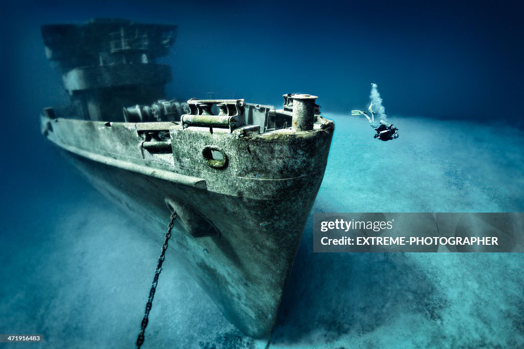 Scuba diver exploring ship wreck
