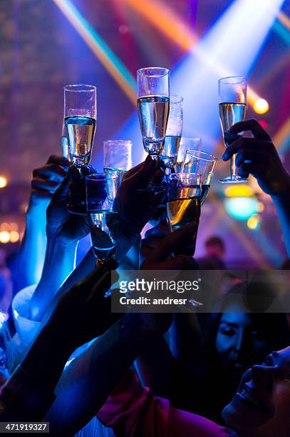 toasting for the new year - night club stock pictures, royalty-free photos & images