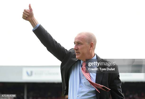 Brentford Manager Mark Warburton salutes the fans during the Sky Bet Championship match between Brentford and Wigan Athletic at Griffin Park on May...