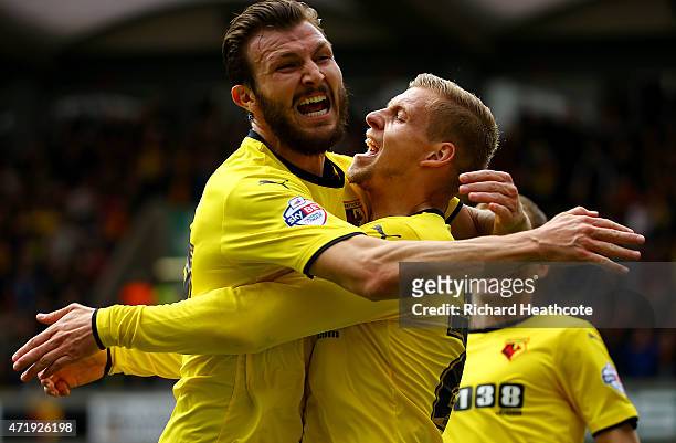 Matej Vydra of Watford celebrates scoring his team's first goal with his team mate Marco Motta during the Sky Bet Championship match between Watford...