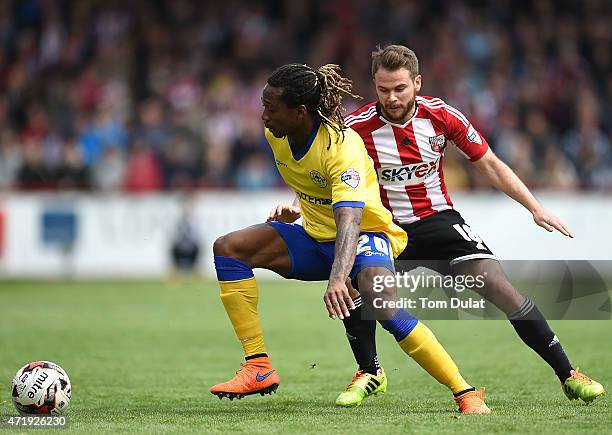 Alan Judge of Brentford and Gaetan Bong of Wigan Athletic in action during the Sky Bet Championship match between Brentford and Wigan Athletic at...