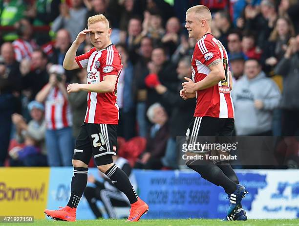 Alex Pritchard of Brentford celebrates scoring the opening goal during the Sky Bet Championship match between Brentford and Wigan Athletic at Griffin...