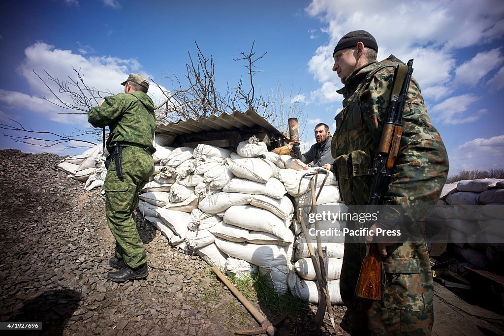 DNR soldiers seen in a look out post at the front line in...