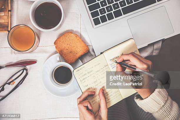 having breakfast in early morning - agenda diary stock pictures, royalty-free photos & images