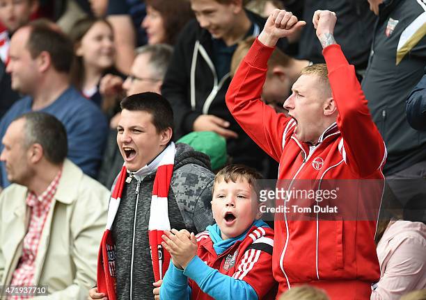 Brentford fans celebrate during the Sky Bet Championship match between Brentford and Wigan Athletic at Griffin Park on May 2, 2015 in Brentford,...