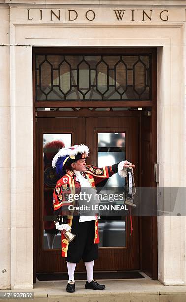 Town crier Tony Appleton makes an announment of the birth of Catherine, Duchess of Cambridge and Prince William's second child, a daughter, outside...