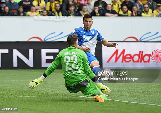 Kevin Volland of Hoffenheim scores his team's first goal past goalkeeper Mitchell Langerak of Dortmund during the Bundesliga match between 1899...