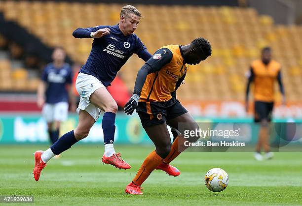 Bakary Sako of Wolves holds off pressure from Lee Martin of Millwall during the Sky Bet Championship match between Wolverhampton Wanderers and...
