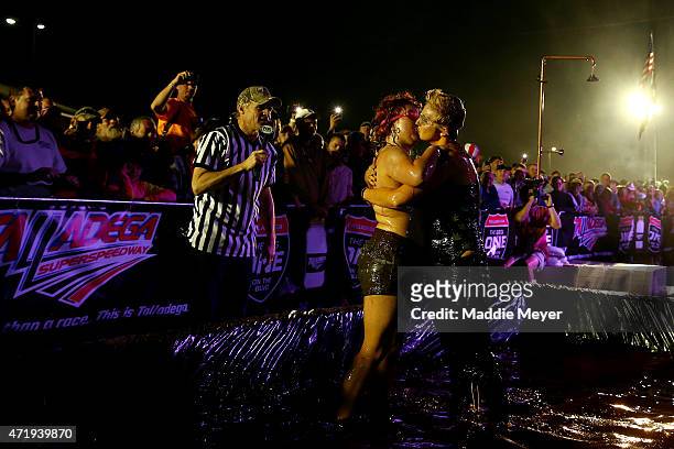 Fans wrestle in barbecue sauce on the infield at Talladega Superspeedway on May 1, 2015 in Talladega, Alabama.
