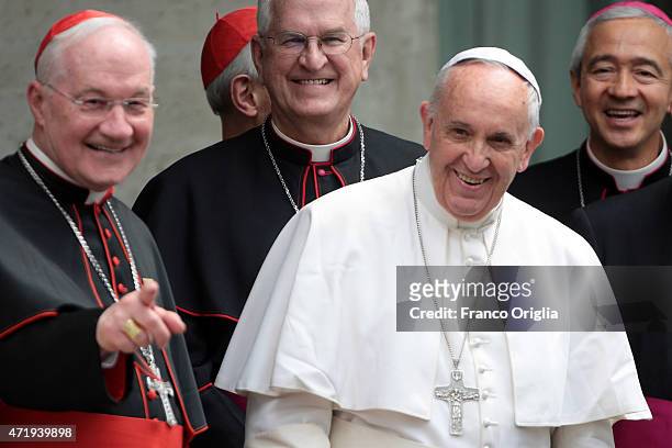 Pope Francis , flanked by Cardinal Marc Ouellet and President of the United States Conference of Catholic Bishops Joseph Edward Kurtz, leaves the...