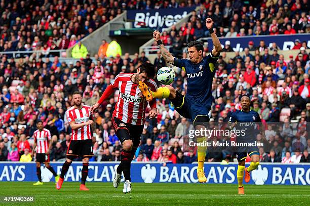 Danny Graham of Sunderland is challenged by Jose Fonte of Southampton leading to a penalty during the Barclays Premier League match between...