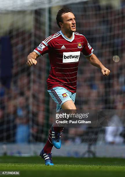 Mark Noble of West Ham United celebrates scoring his team's first goal from the penalty spot during the Barclays Premier League match between West...