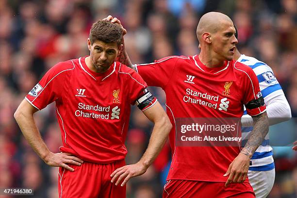 Steven Gerrard of Liverpool is consoled by Martin Skrtel of Liverpool after missing his penalty during the Barclays Premier League match between...