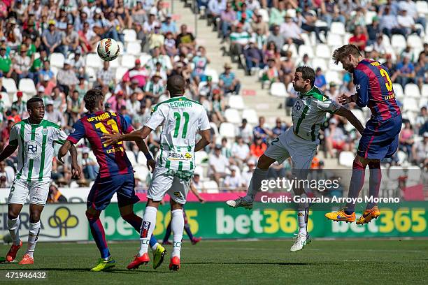 Gerard Pique of FC Barcelona scores their fifth goal during the La Liga match between Cordoba CF and Barcelona FC at El Arcangel stadium on May 2,...