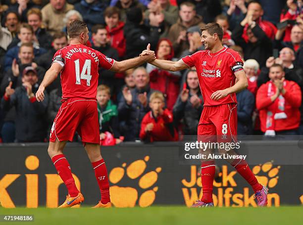 Steven Gerrard of Liverpool celebrates his goal with Jordan Henderson during the Barclays Premier League match between Liverpool and Queens Park...