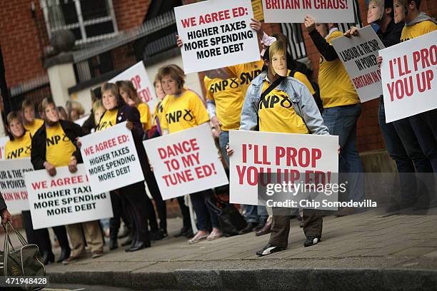 With five days to go before the UK general elections, Conservative supporters masquerade as Scottish National Party leader Nicola Sturgeon outside a...