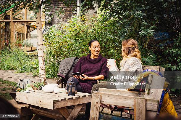 two friends take tea in the garden - vintage funny black and white stock pictures, royalty-free photos & images