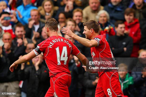 Steven Gerrard of Liverpool celebrates his goal with Jordan Henderson during the Barclays Premier League match between Liverpool and Queens Park...