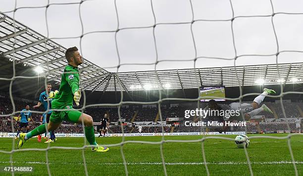 Jefferson Montero of Swansea City scores his team's first goal past Jack Butland of Stoke City during the Barclays Premier League match between...