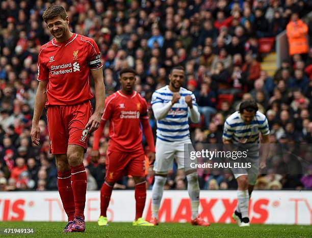 Liverpool's English midfielder Steven Gerrard reacts after missing a penalty during the English Premier League football match between Liverpool and...