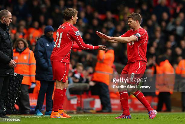 Steven Gerrard of Liverpool shakes hands with Lucas Leiva as he is replaced during the Barclays Premier League match between Liverpool and Queens...