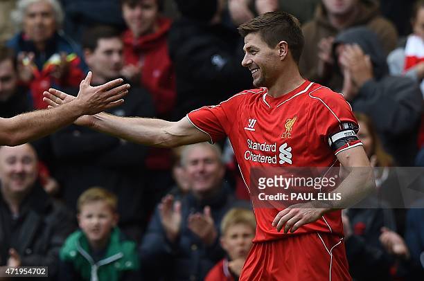 Liverpool's English midfielder Steven Gerrard celebrates his winning goal during the English Premier League football match between Liverpool and...