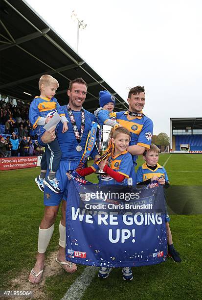 Liam Lawrence of Shrewsbury Town celebrates with the runners up trophy alongside team-mate Andy Mangan and their children following the Sky Bet...