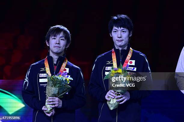 Kenta Matsudaira and Koki Niwa of Japan stand on the podium after men's mixed doubles final match on day seven of the 2015 World Table Tennis...