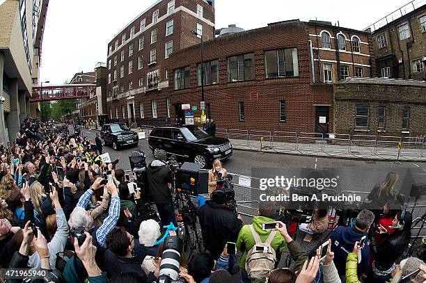 Catherine, Duchess of Cambridge and Prince William, Duke of Cambridge depart the Lindo Wing with their newborn daughter at St Mary's Hospital on May...