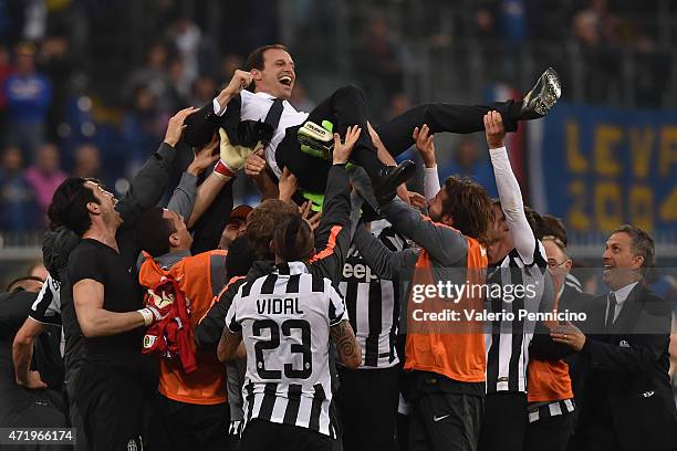 Massimiliano Allegri head coach of Juventus FC is lifted by his players at the end of the Serie A match between UC Sampdoria and Juventus FC at...