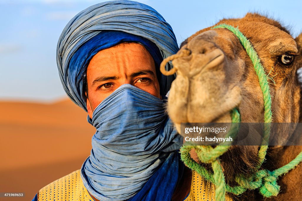 Young Tuareg with camel on Western Sahara Desert in Africa