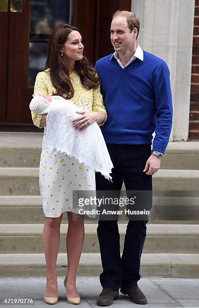 Catherine Duchess of Cambridge, wearing a Jenny Packham dress, and Prince William, Duke of Cambridge leave the Lindo Wing at St. Mary's Hospital with...