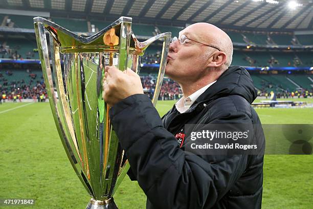 Bernard Laporte the head coach of Toulon celebrates with the trophy following his team's victory during the European Rugby Champions Cup Final match...