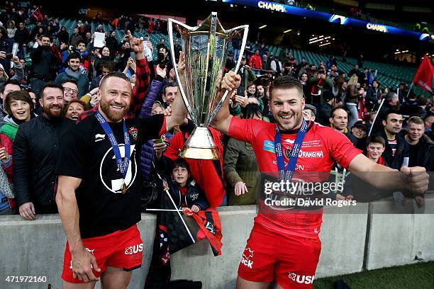 Matt Giteau of Toulon and Drew Mitchell of Toulon celebrate with the trophy during the European Rugby Champions Cup Final match between ASM Clermont...
