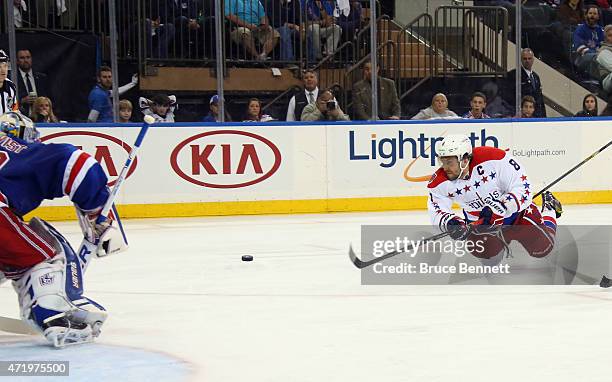 Alex Ovechkin of the Washington Capitals scores a third period goal against Henrik Lundqvist of the New York Rangers in Game Two of the Eastern...